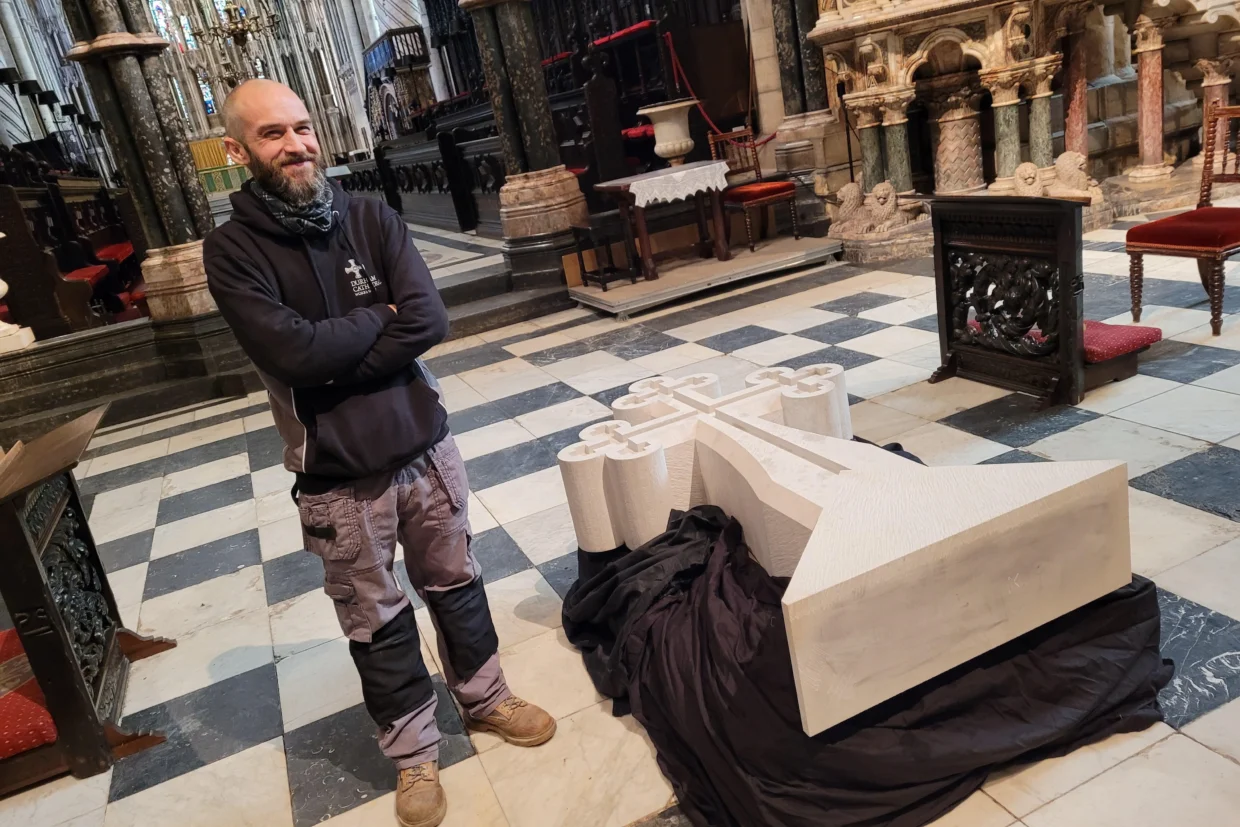 Peter Crinnon with the Stone South Transept Cross in the Cathedral.