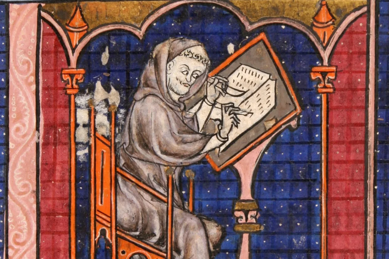 Manuscript illustration of a monk writing