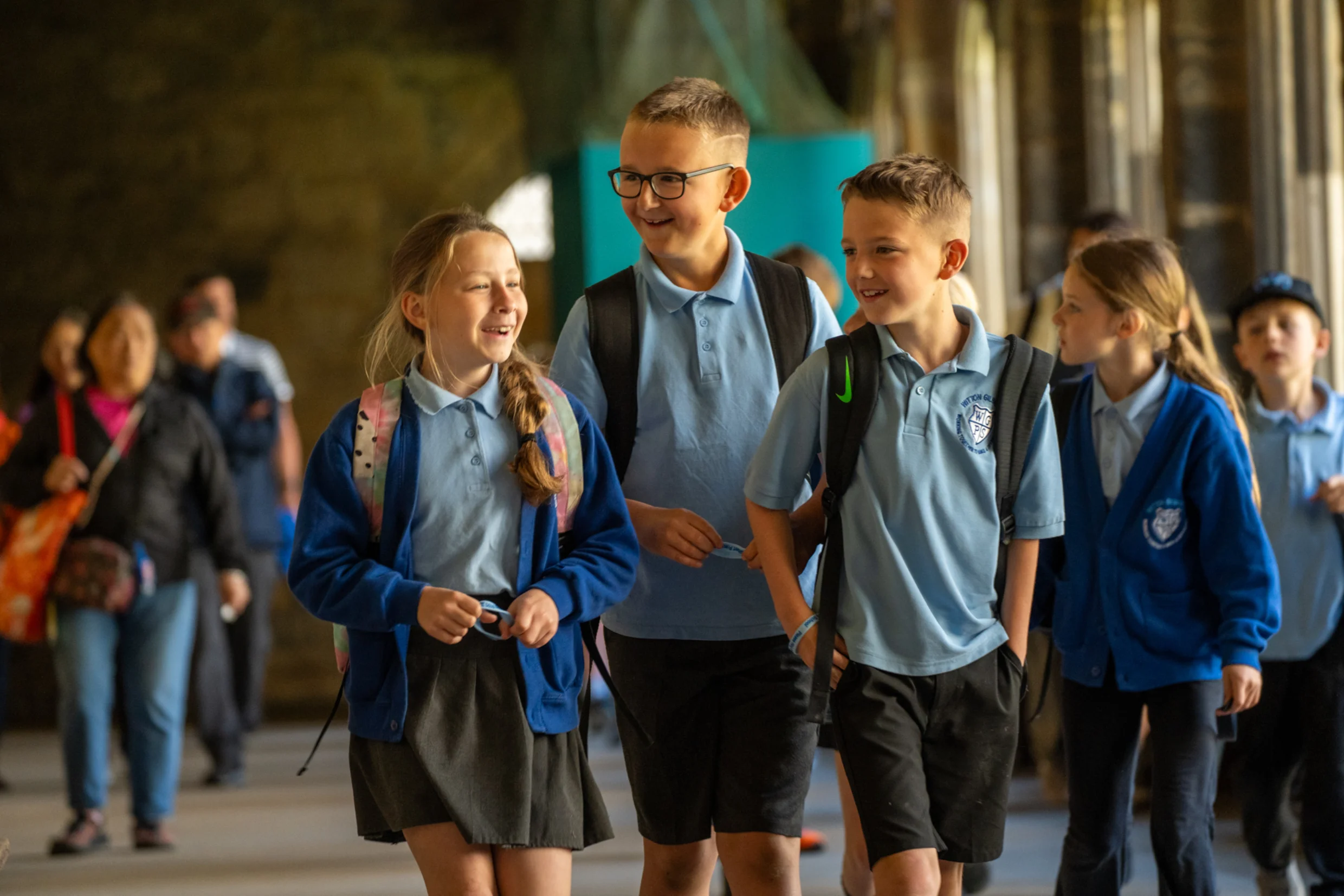 School children walking through cloister